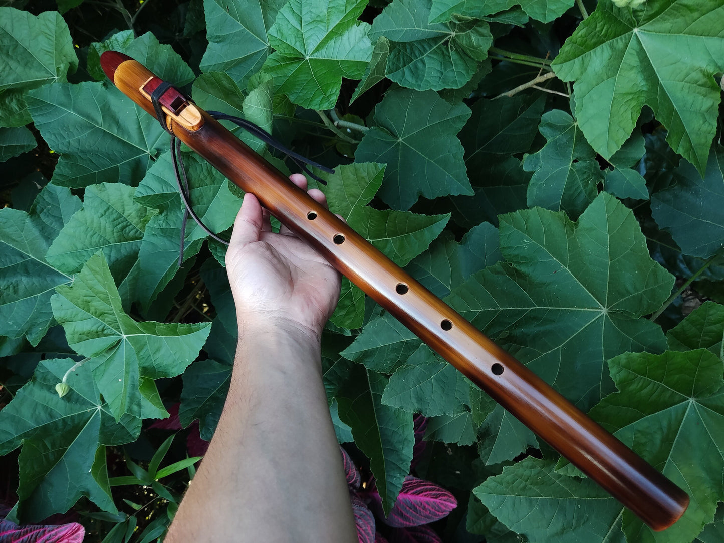 Ethnic Native American and Oriental bamboo flute in the key of low D. Low D NA deep meditation flute. Rustic flute. Indian flute